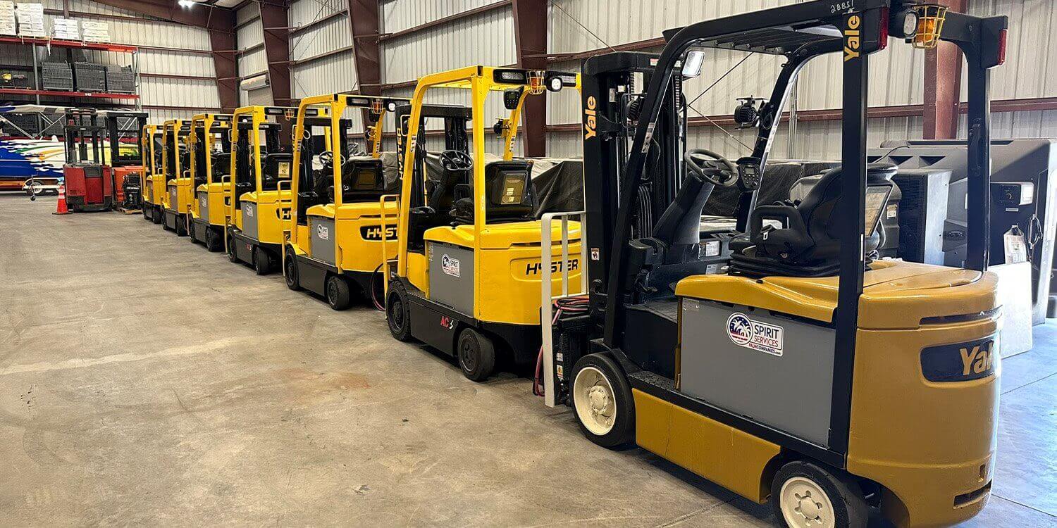 Lineup of Yale & Hyster Forklifts in Spirit Services' Shop